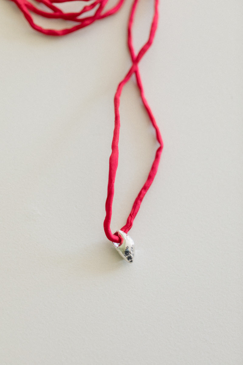 NO. 20 VENUS PEARL WITH A RED SILK CORD