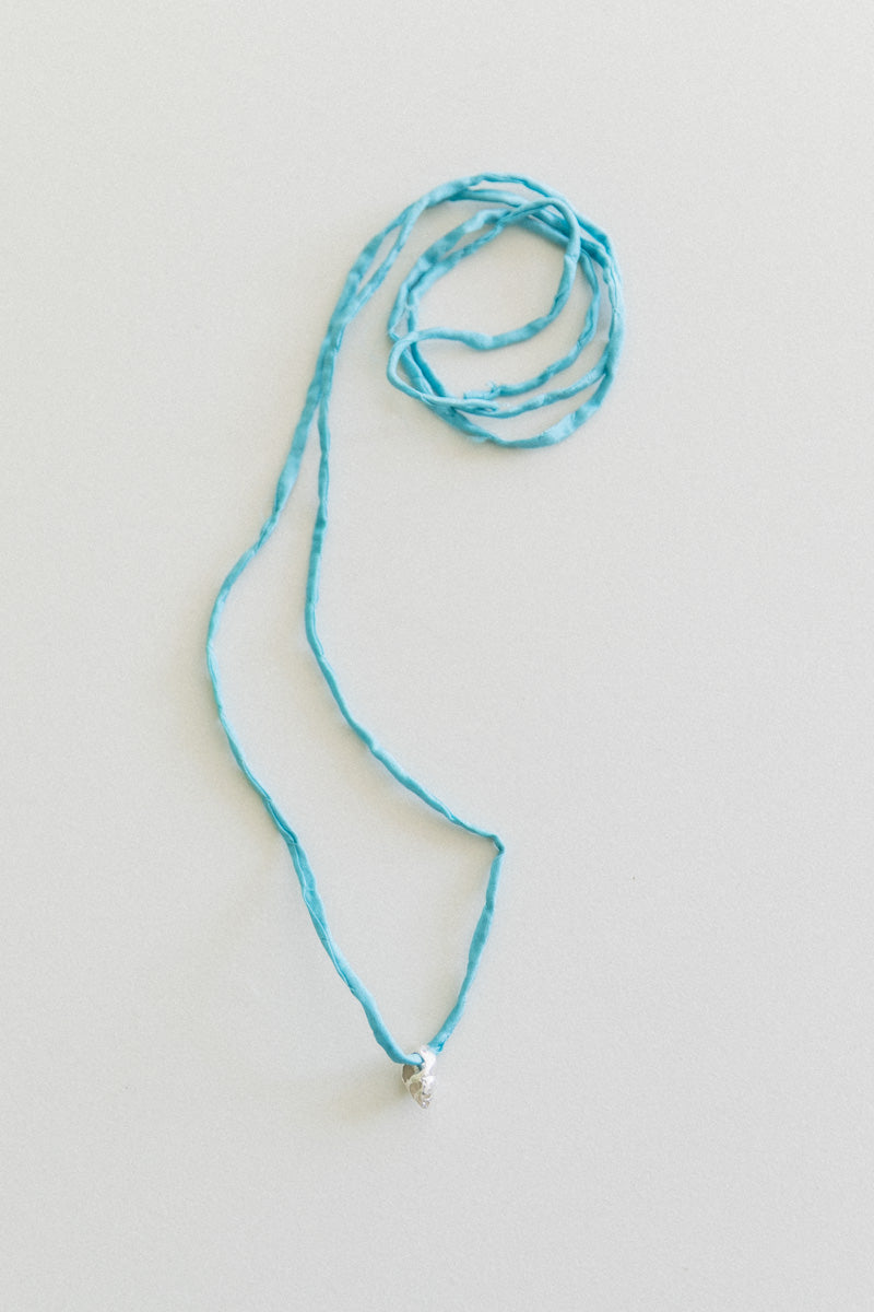 NO. 20 VENUS PEARL WITH A BLUE SILK CORD