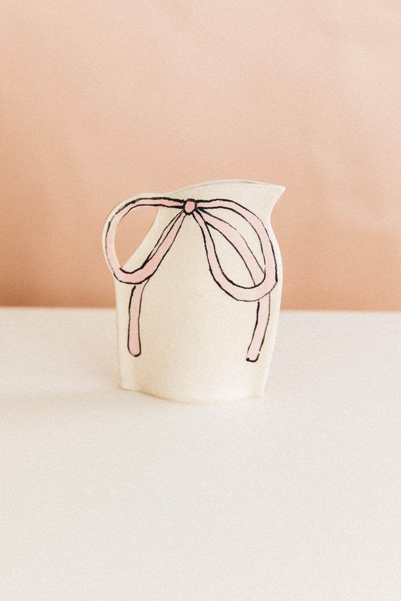 VASE WITH BLUE AND PINK BOW