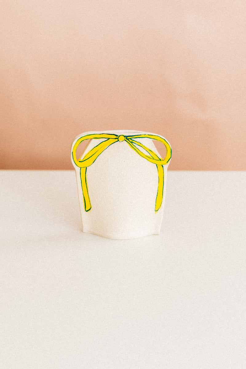 DOUBLE HANDLE VASE WITH YELLOW AND PINK BOW