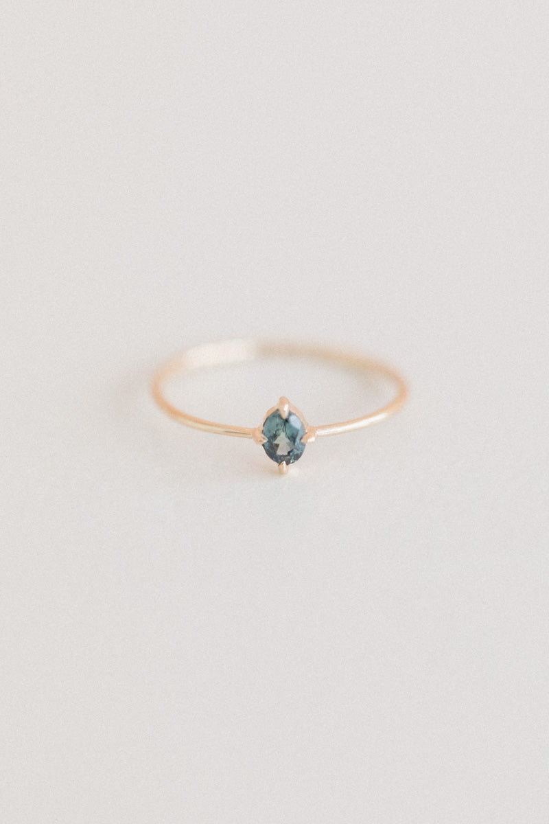 LITTLE SPARK RING WITH AN OVAL TEAL SAPPHIRE