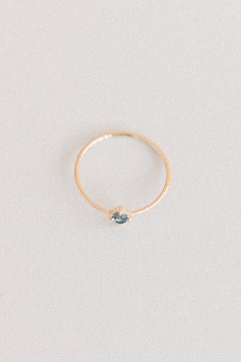 LITTLE SPARK RING WITH AN OVAL TEAL SAPPHIRE