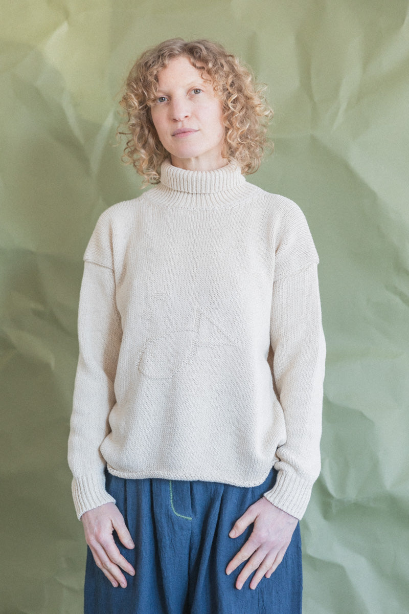 ROLL NECK FISH SWEATER IN ECRU COTTON