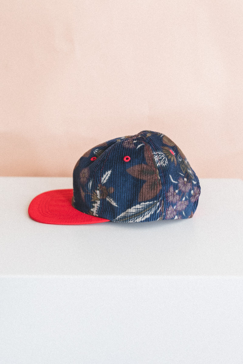 BASEBALL CAP IN FLORAL CORDUROY AND RED SILK