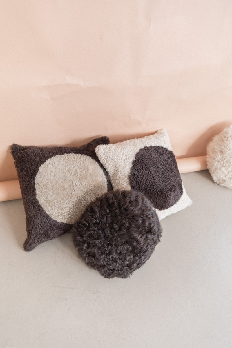 ROUND SHEARLING PILLOW IN LICORICE