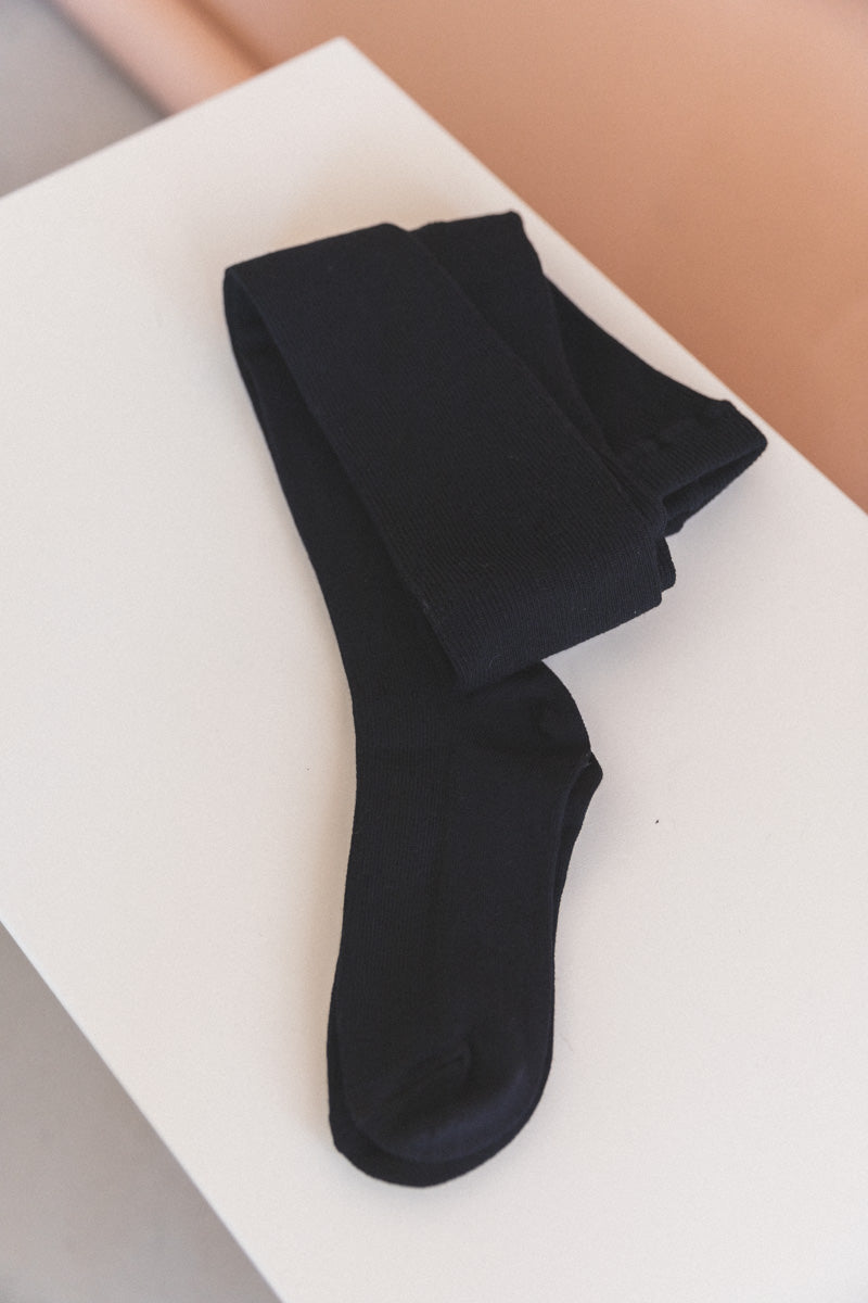 MERINO WOOL RIBBED TIGHTS IN BLACK